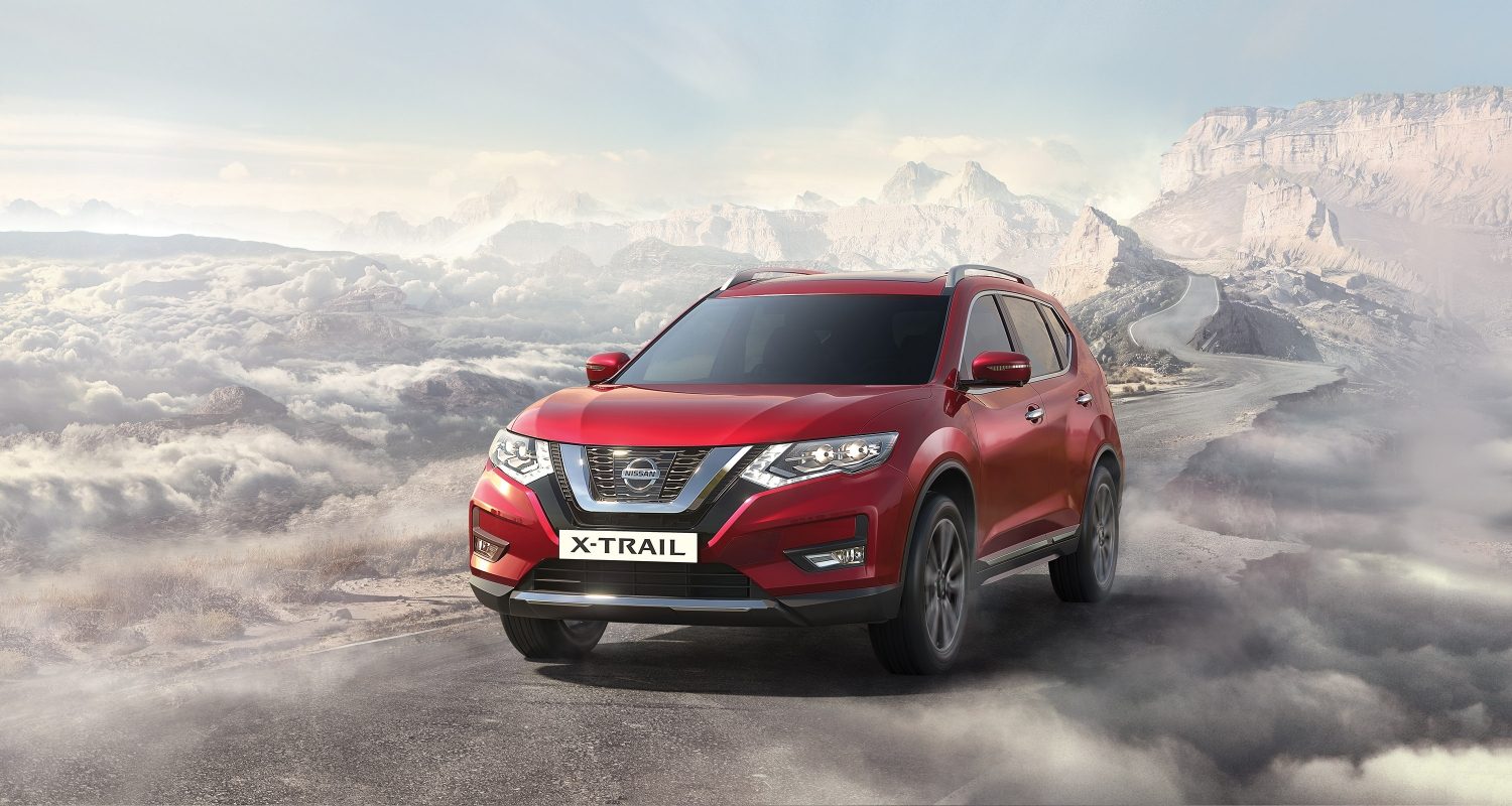 NISSAN X-TRAIL driving on a mountain road